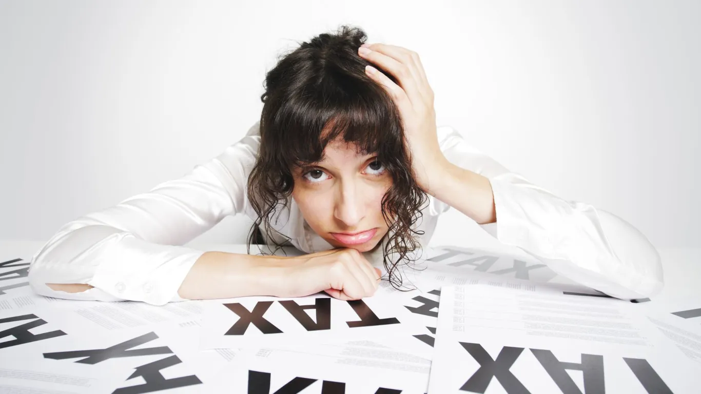 Divorced woman wondering about taxes and divorce settlement