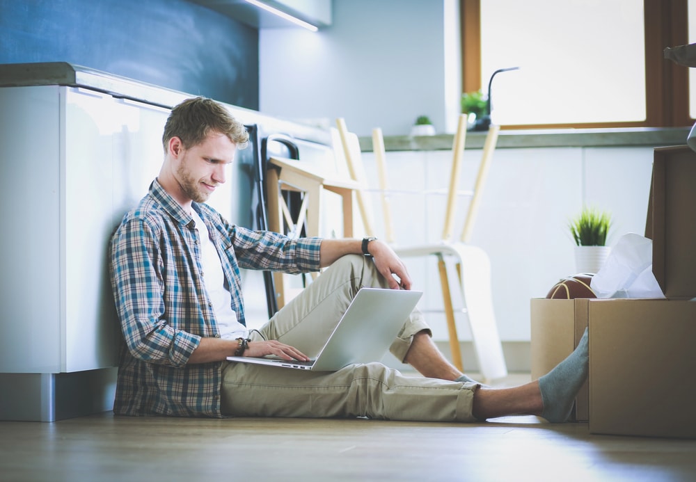 a renter looking at recent research on property tax increases in his kitchen